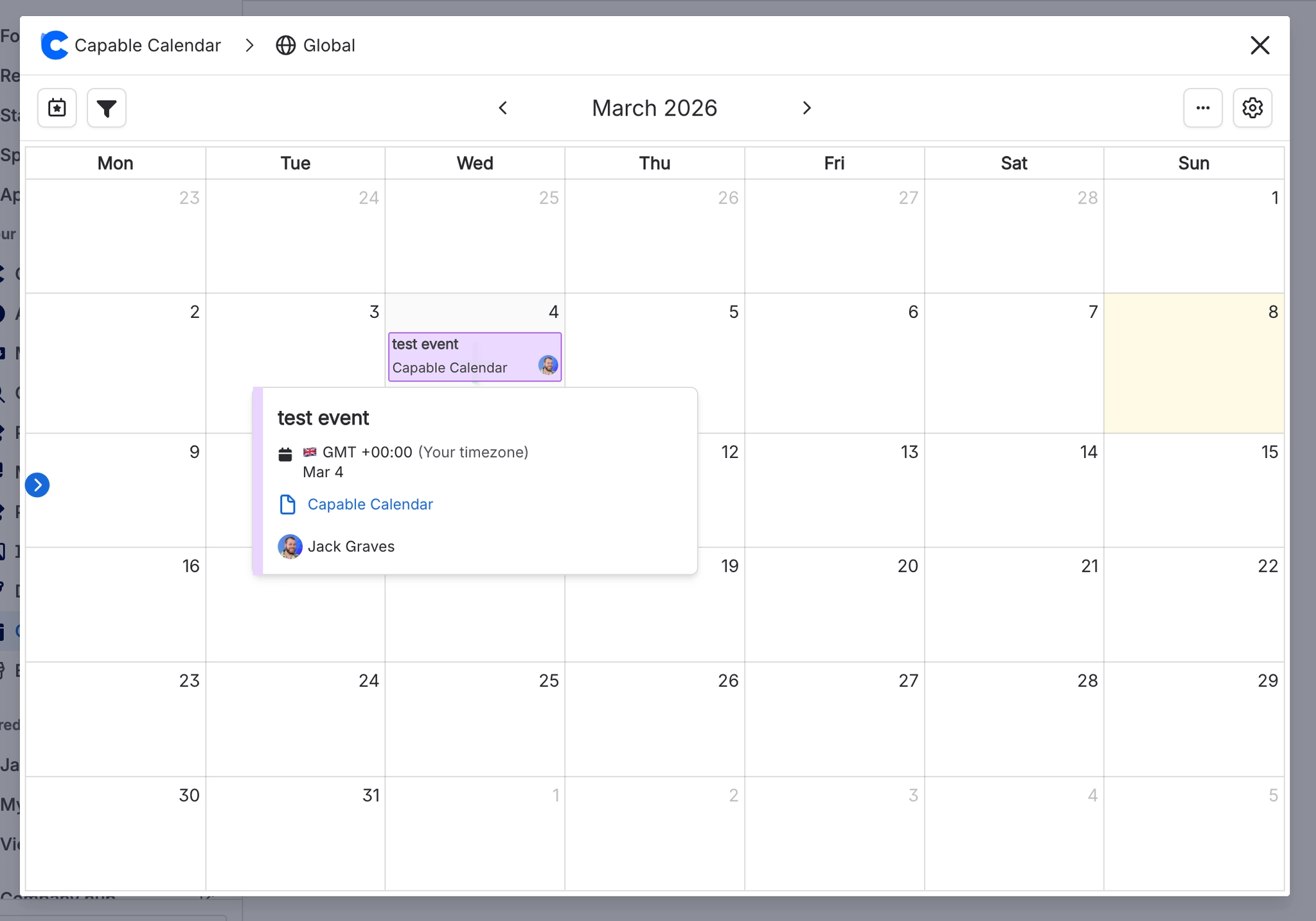 A March month grid with a hover card open for an event named test event, showing the viewer's timezone, the date, a link to the page it came from and one named participant.